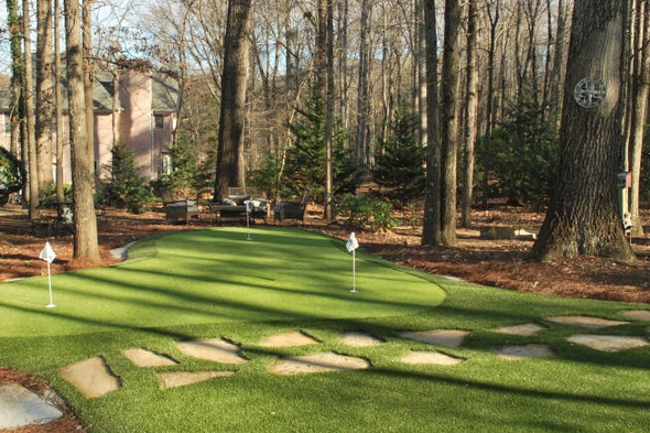 Austin backyard putting green with flags and trees